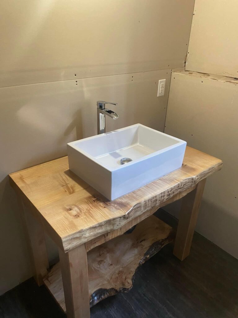 plumbing repair near me rectangular sink and silver faucet set in a raw edged wood counter and stand